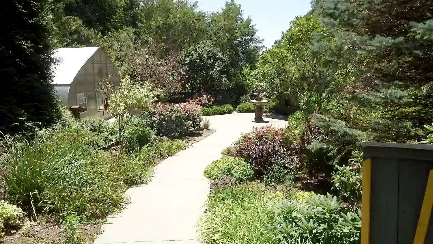 Peaceful garden path at Thistle & Thread at the Parkway